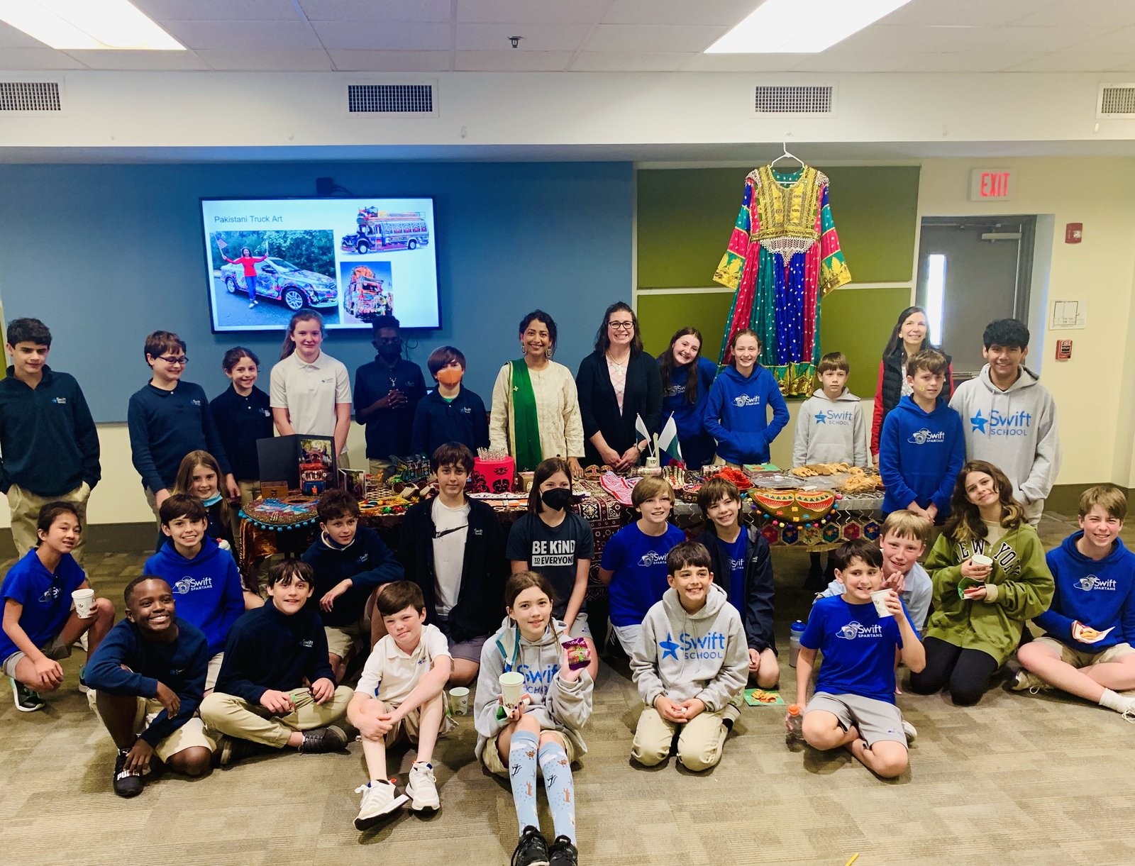 Sanam Azeem with students and faculty at The Swift School